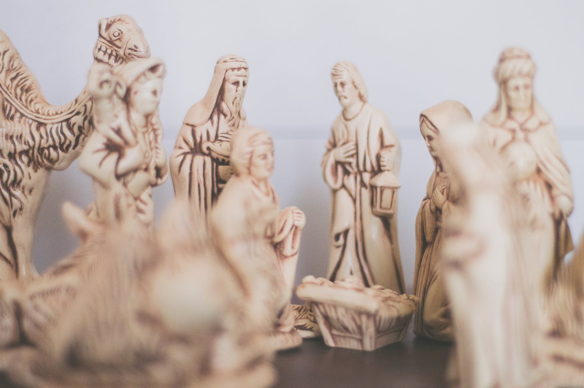 shallow focus photography of religious figurines wise men at the nativity scene