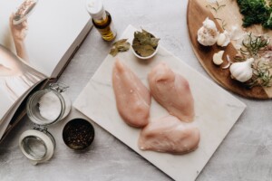 preparing chicken on chopping board