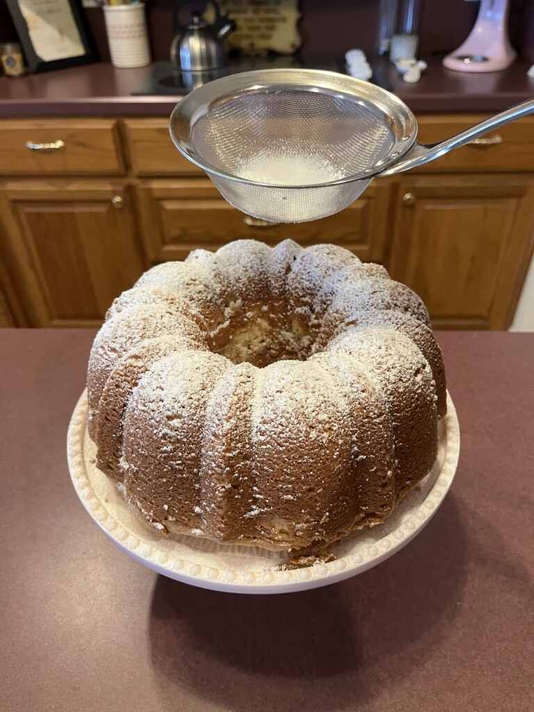 top the pound cake with powdered sugar