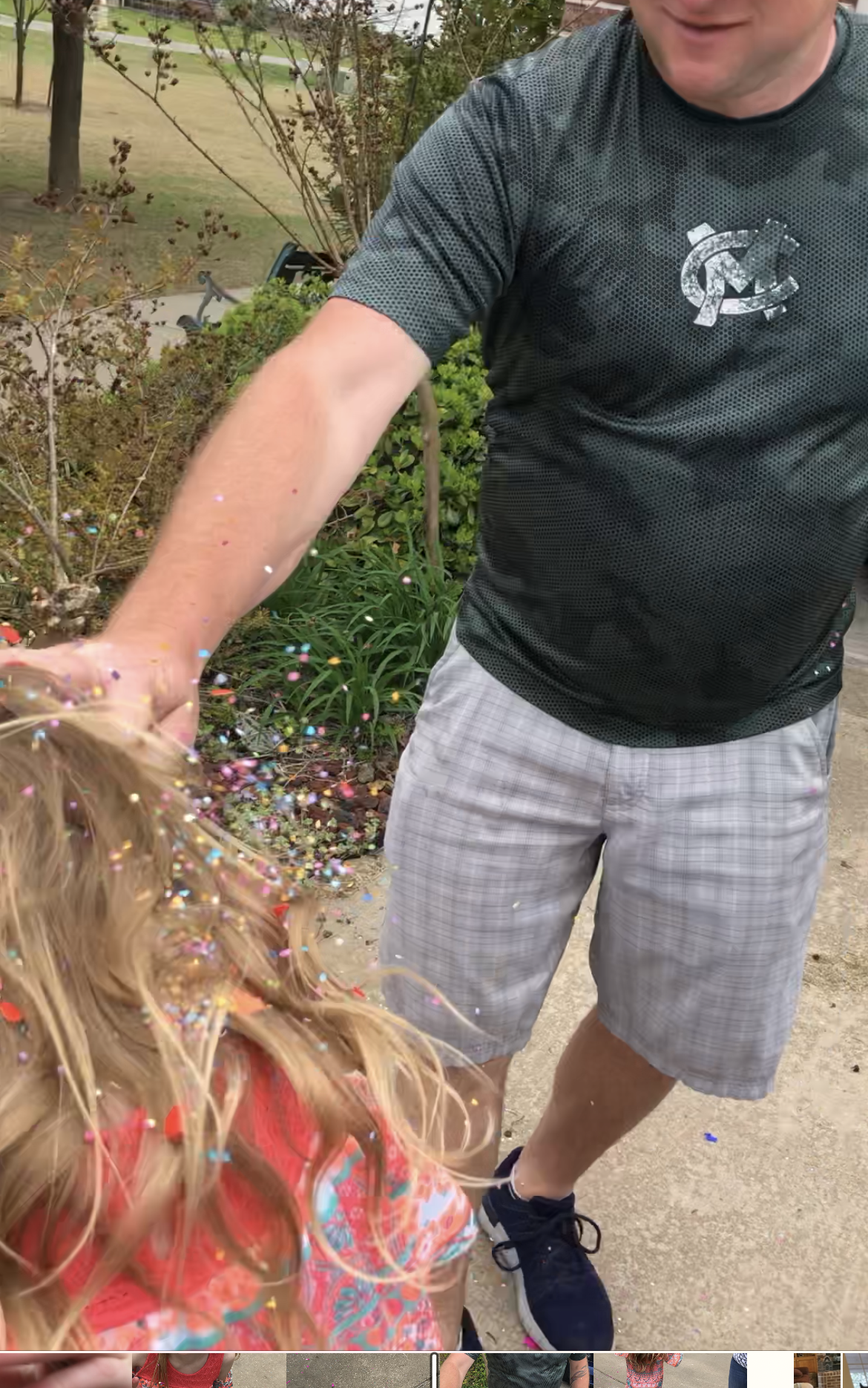girl getting a confetti egg in her hair a fun Easter tradition