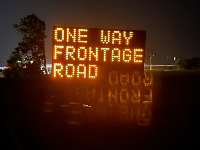 one-way frontage road sign