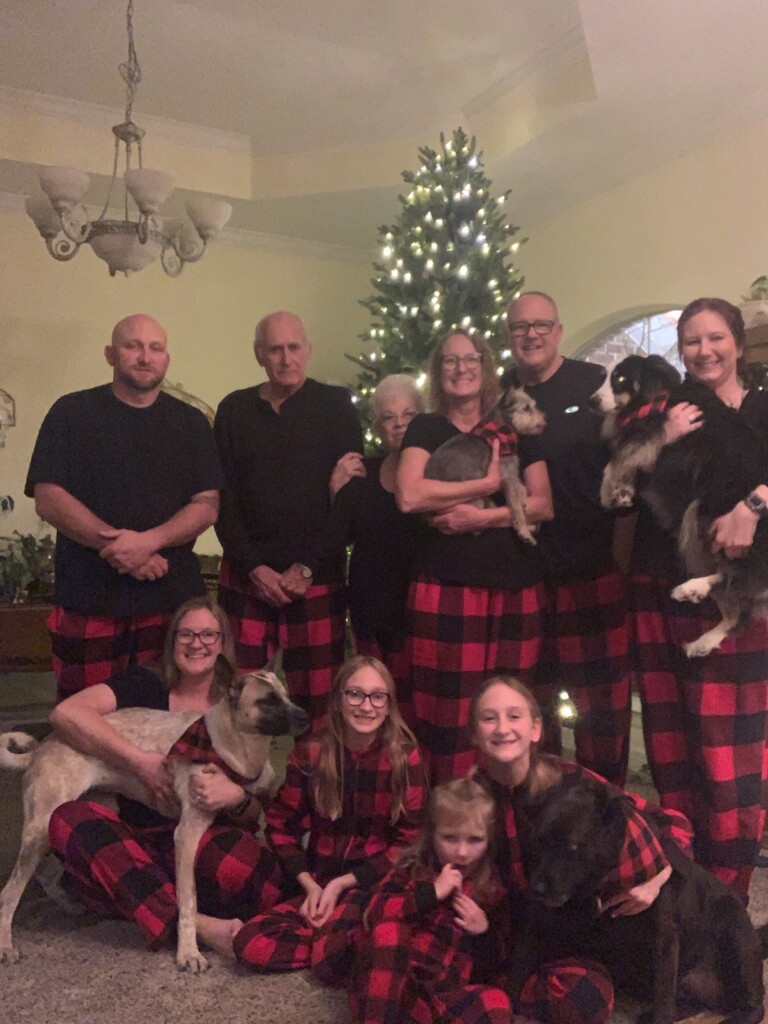 Family Christmas movie night with matching pajamas