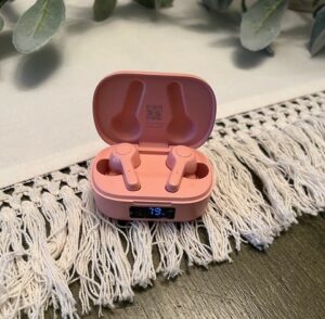 for travel tips and tricks pink earbuds