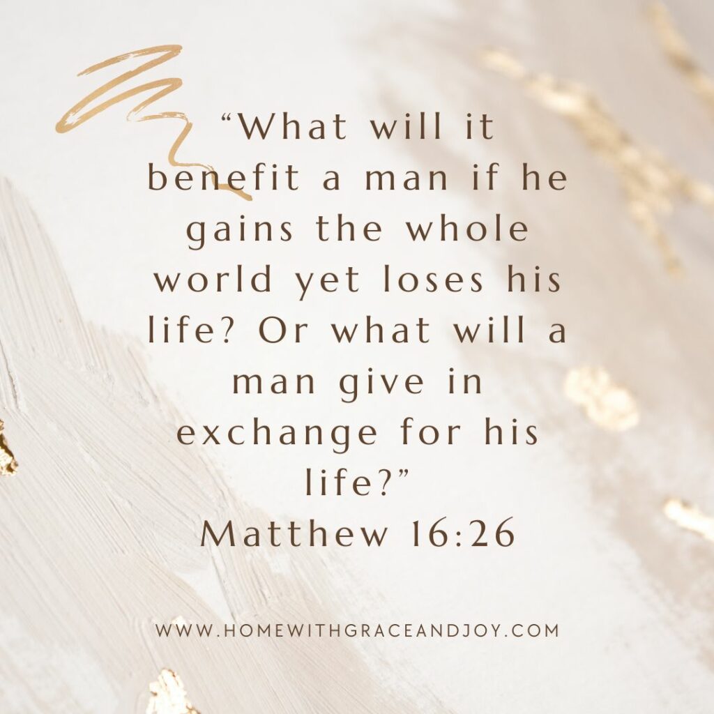 A Pinterest-style inspirational image featuring a quote from the Bible, Matthew chapter 16, on a light wooden background with gold leaf accents. The quote is about the value of life over worldly gains.
